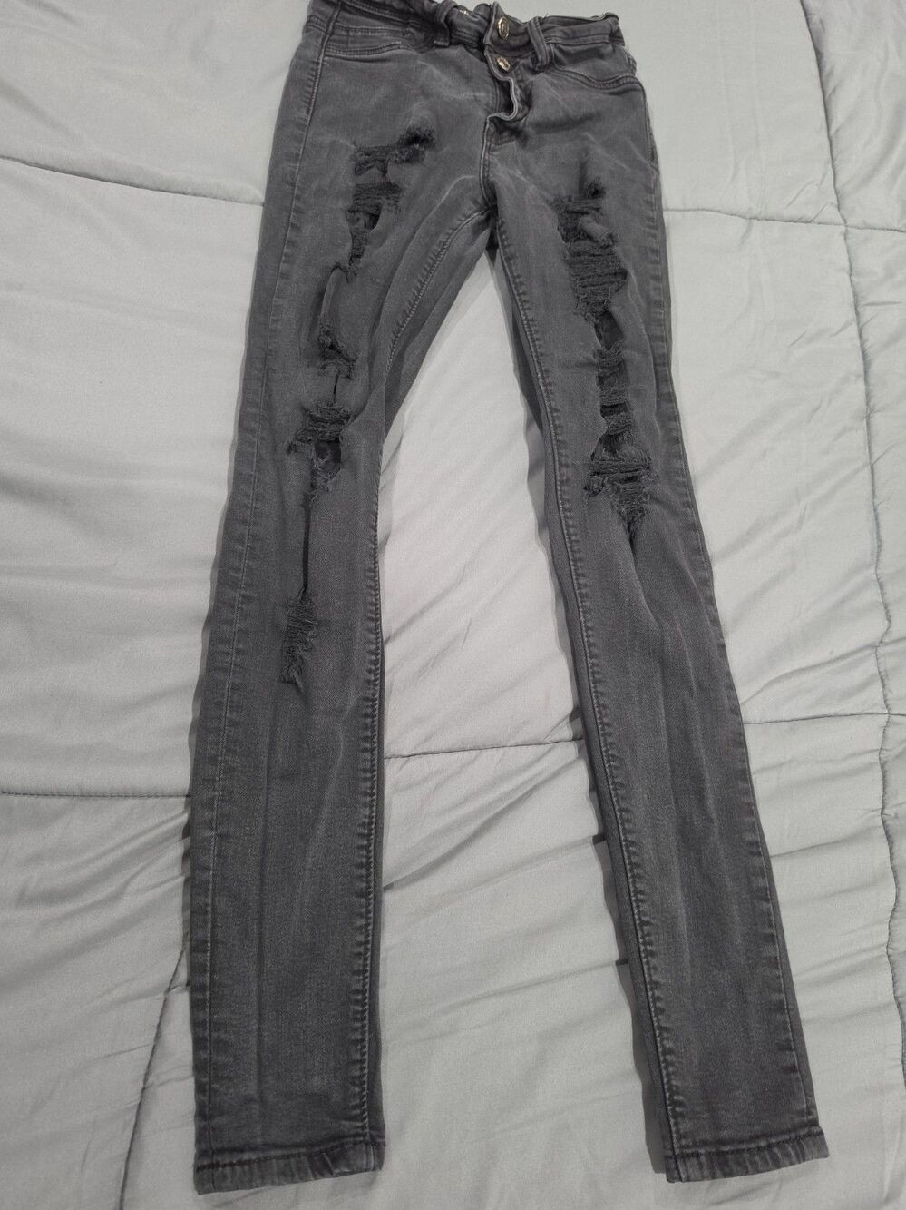 by HammerJeans Los Angeles a knotted waistband detail and a rippedknee design100